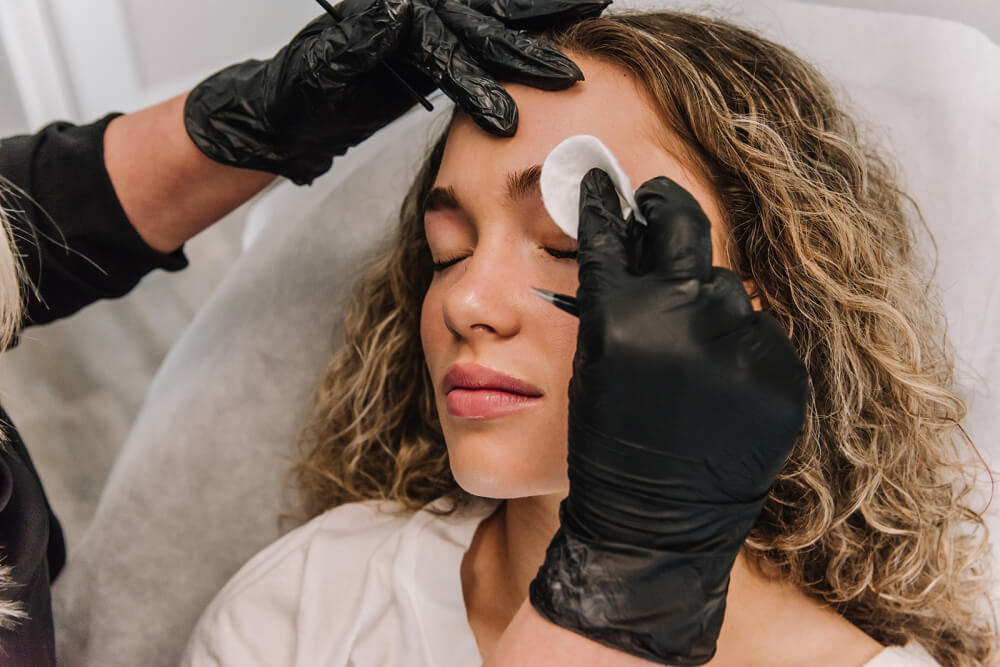 Woman getting her eyebrows done